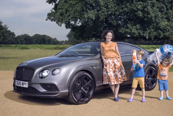 Family with Bentley and Star Wars toys.